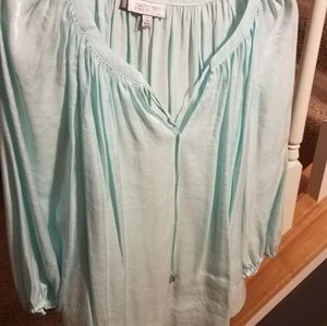 Jennifer Lopez blue shimmery long sleeve shirt